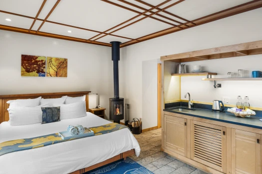 Half Moon bed, wood stove & kitchenette
