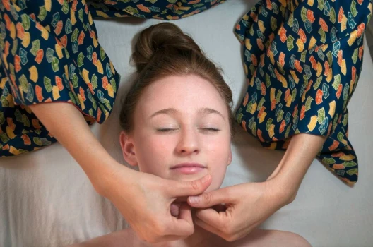 Organic facial treatment on woman's chin